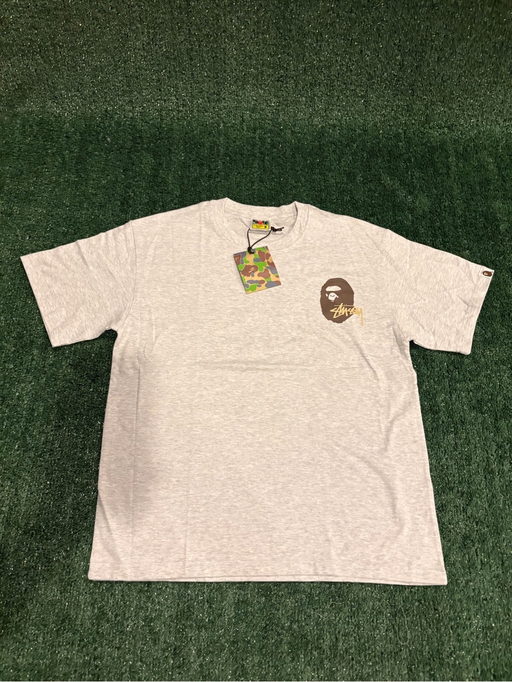 Stussy Light Gray Short Sleeve Tee with Brown Camo Ape Logo